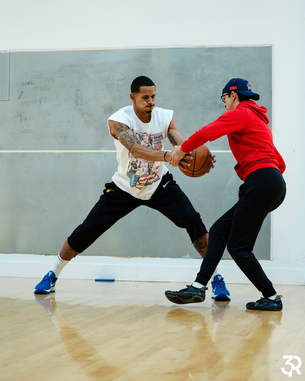 An HD Performance coach pressuring a player one-on-one during a ball-protection drill