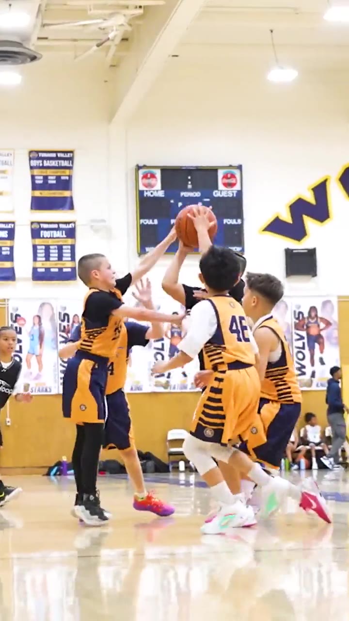 Just Hoop game film: a player celebrating at the rim